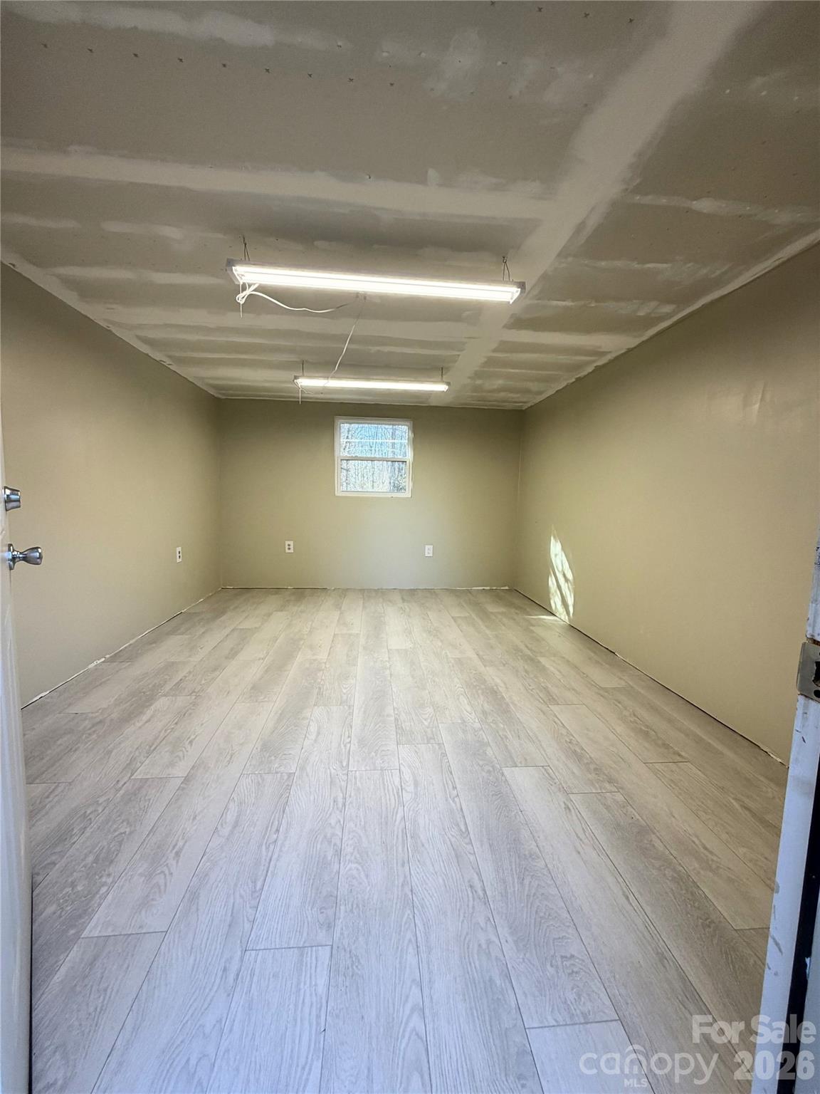 308 Springhill Lane Maiden, NC 28650 - Photo 21 of 21 a view of empty room with wooden floor and fan