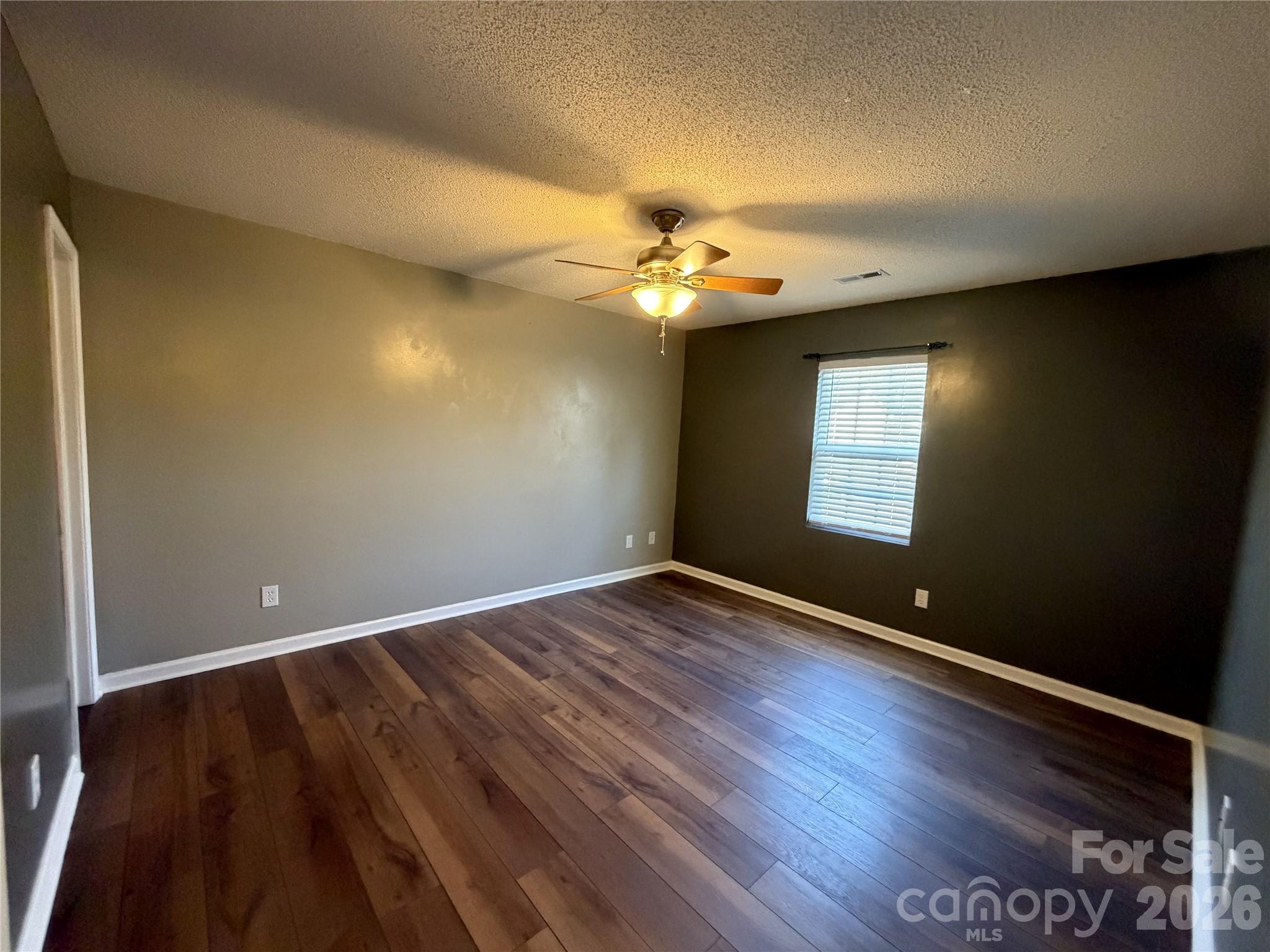 308 Springhill Lane Maiden, NC 28650 - Photo 8 of 21 wooden floor in an empty room with a window