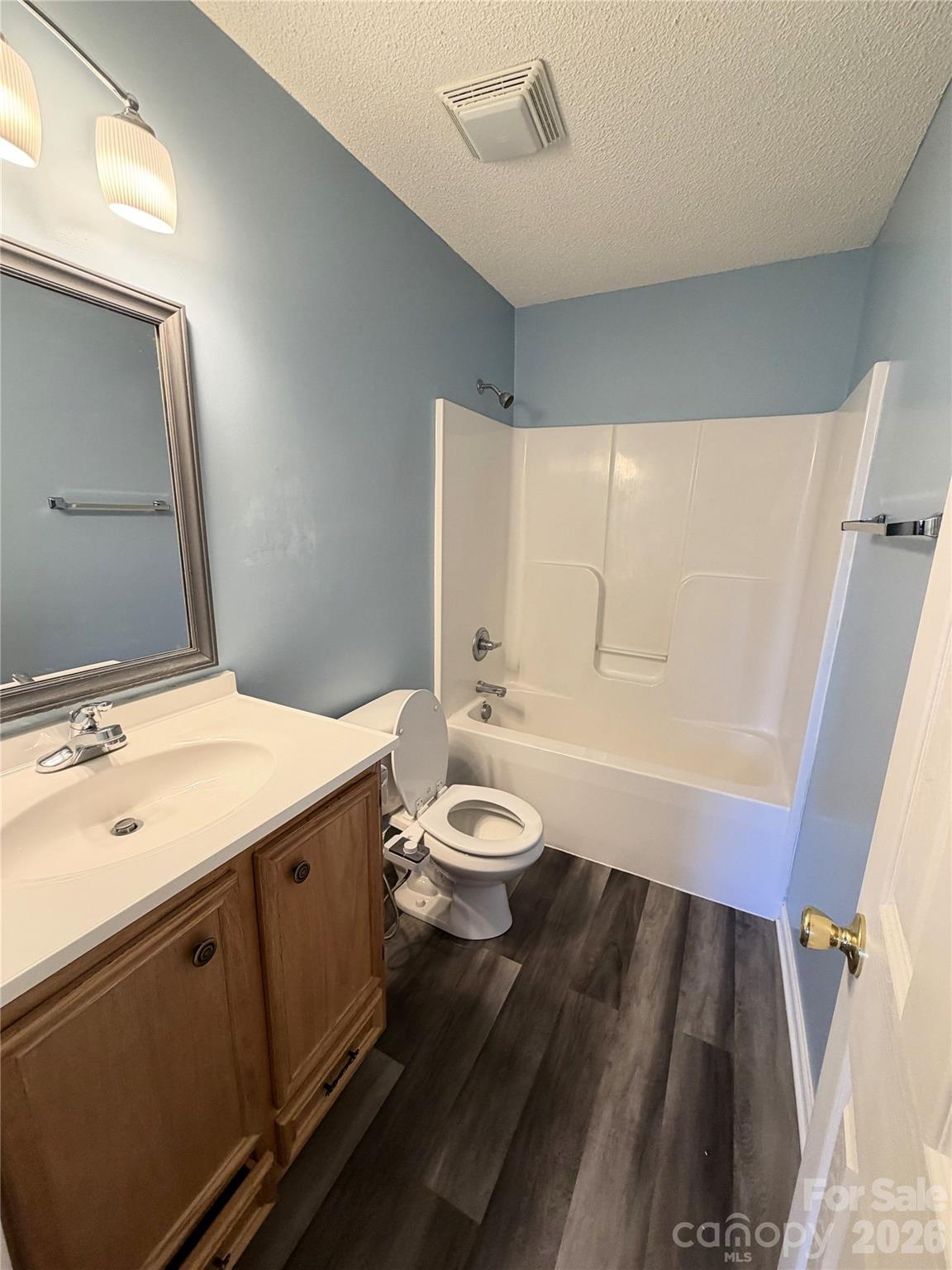 308 Springhill Lane Maiden, NC 28650 - Photo 9 of 21 a bathroom with a granite countertop sink toilet a large mirror and shower