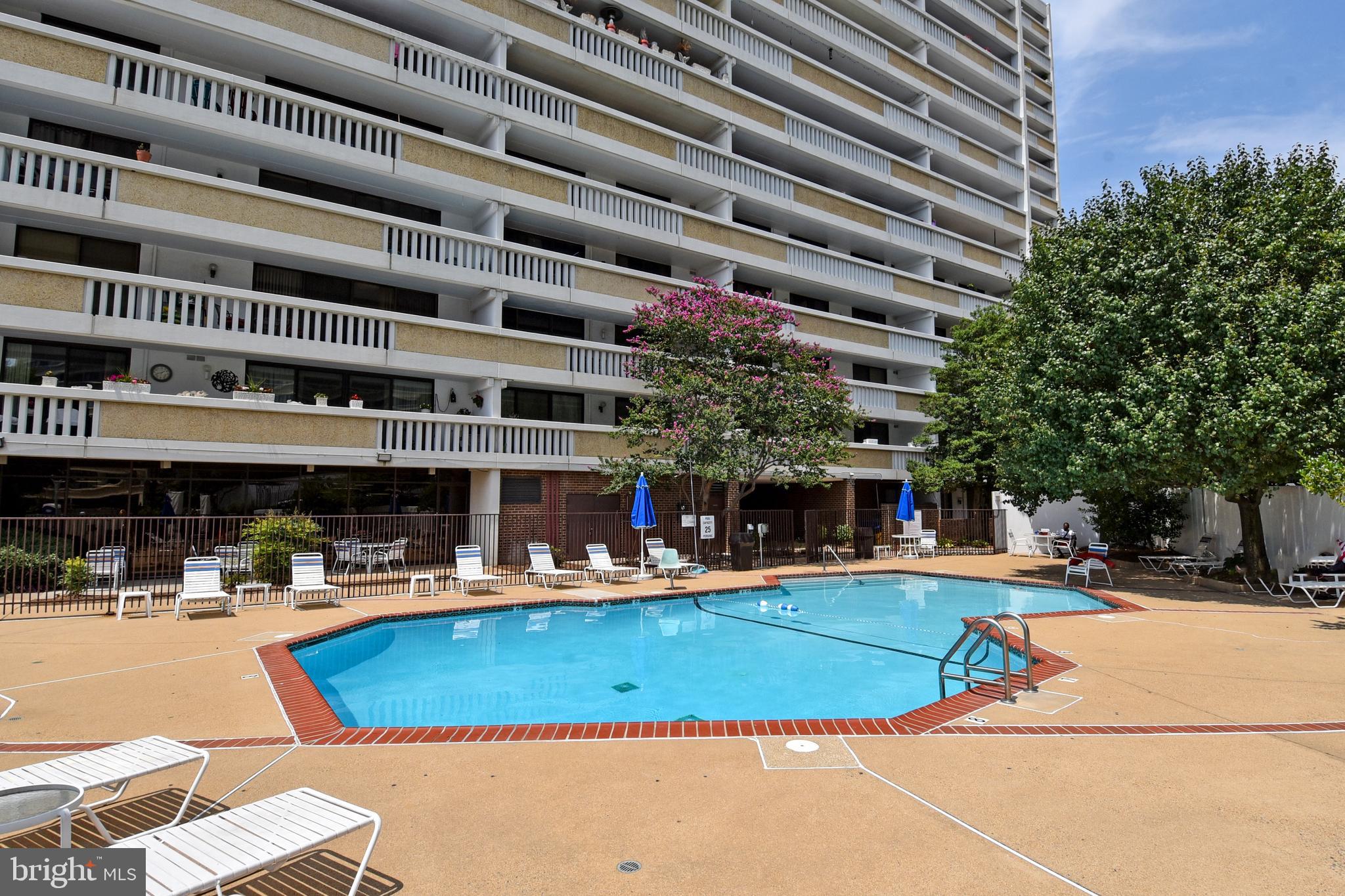 6101 Edsall Road, Unit 1706 Alexandria, VA 22304 - Photo 29 of 40 a view of a swimming pool with outdoor seating