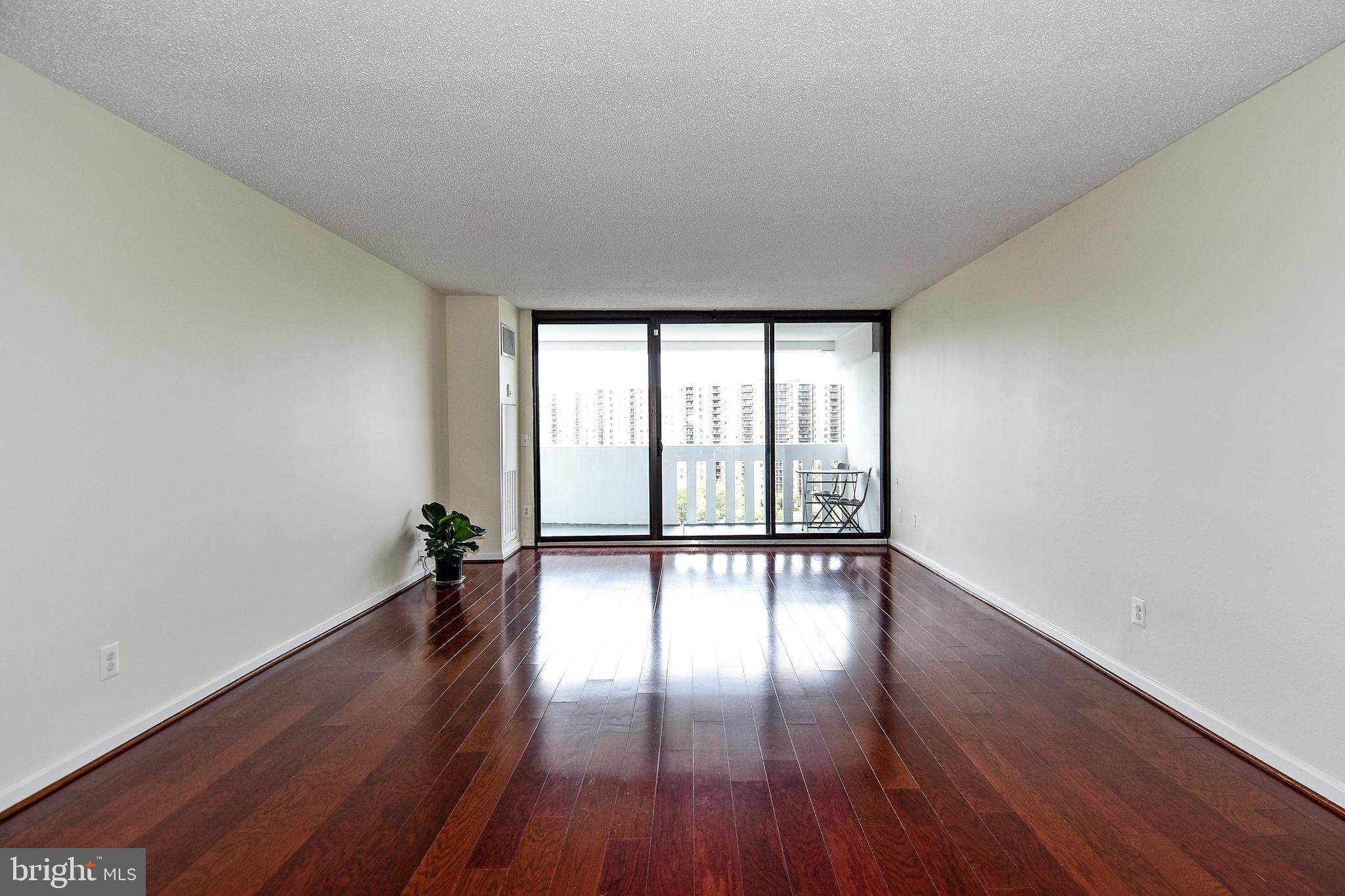 6101 Edsall Road, Unit 1706 Alexandria, VA 22304 - Photo 7 of 40 a view of empty room with wooden floor and fan