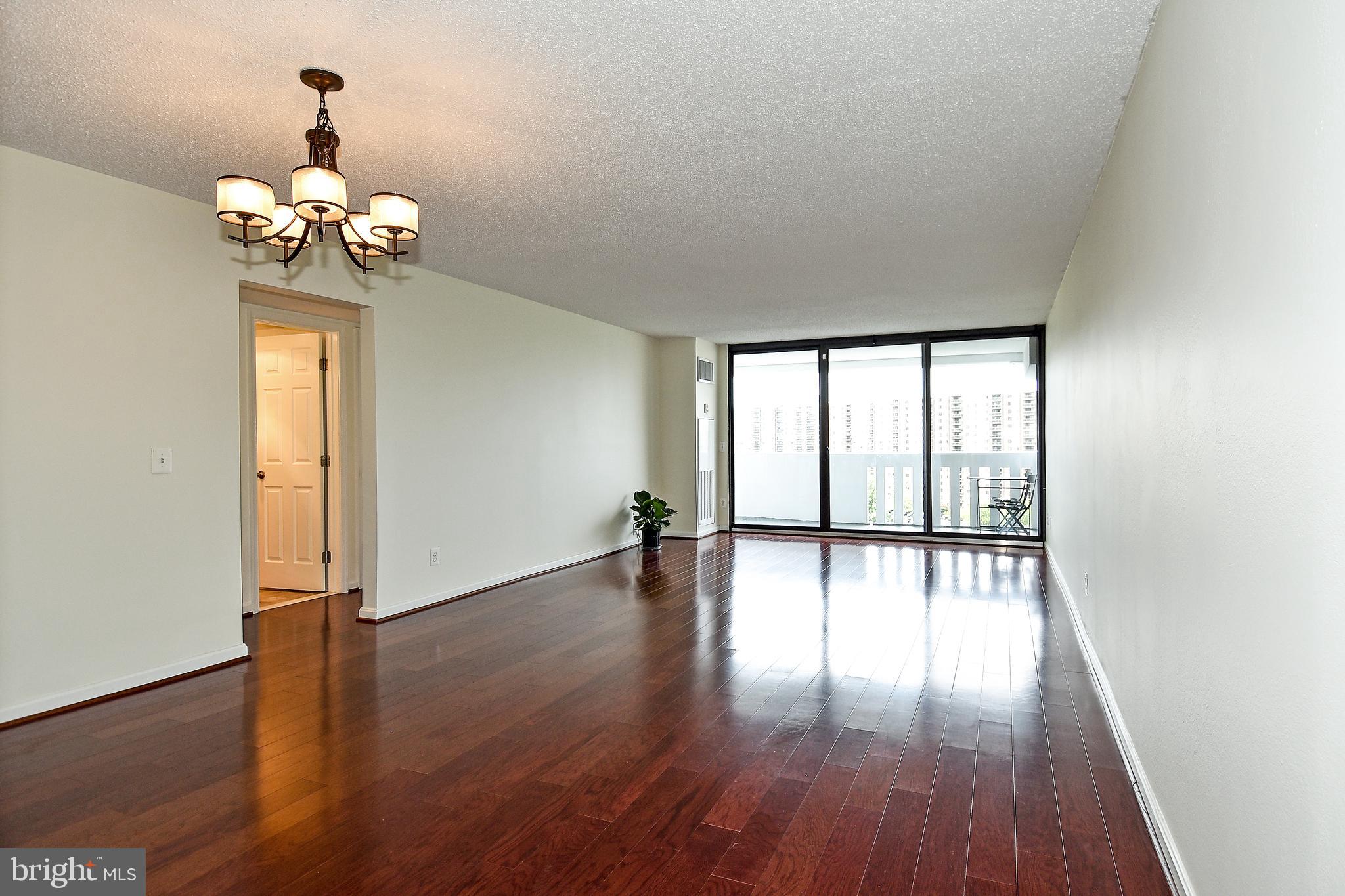 6101 Edsall Road, Unit 1706 Alexandria, VA 22304 - Photo 9 of 40 a view of an empty room with wooden floor