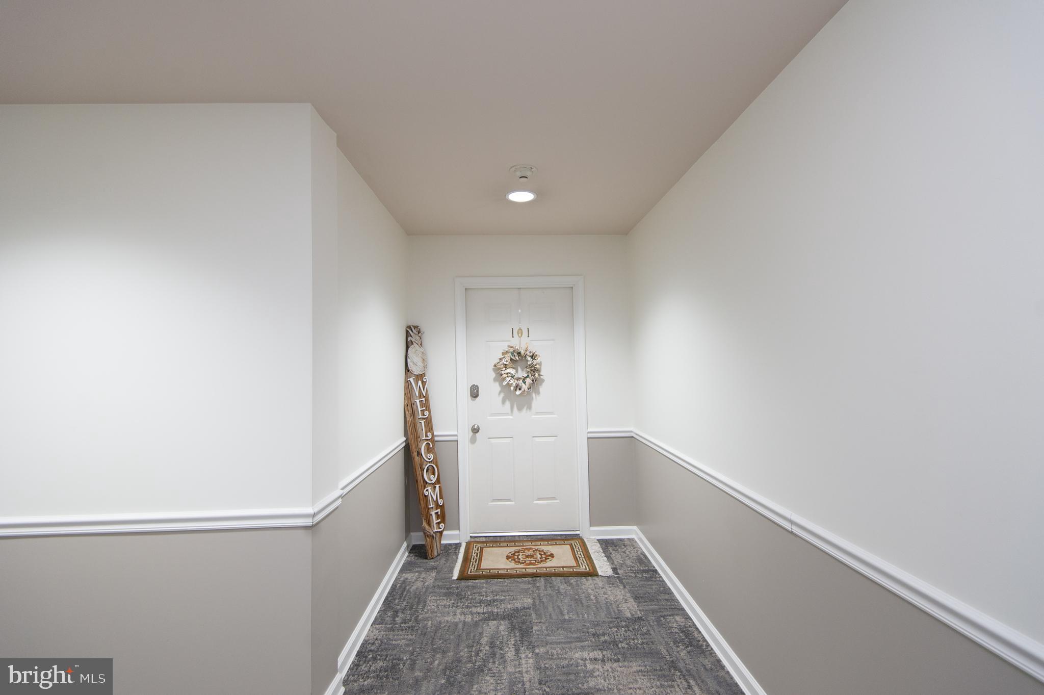 304 Academy Street, Unit 101 Cambridge, MD 21613 - Photo 36 of 56 Entry door to condo