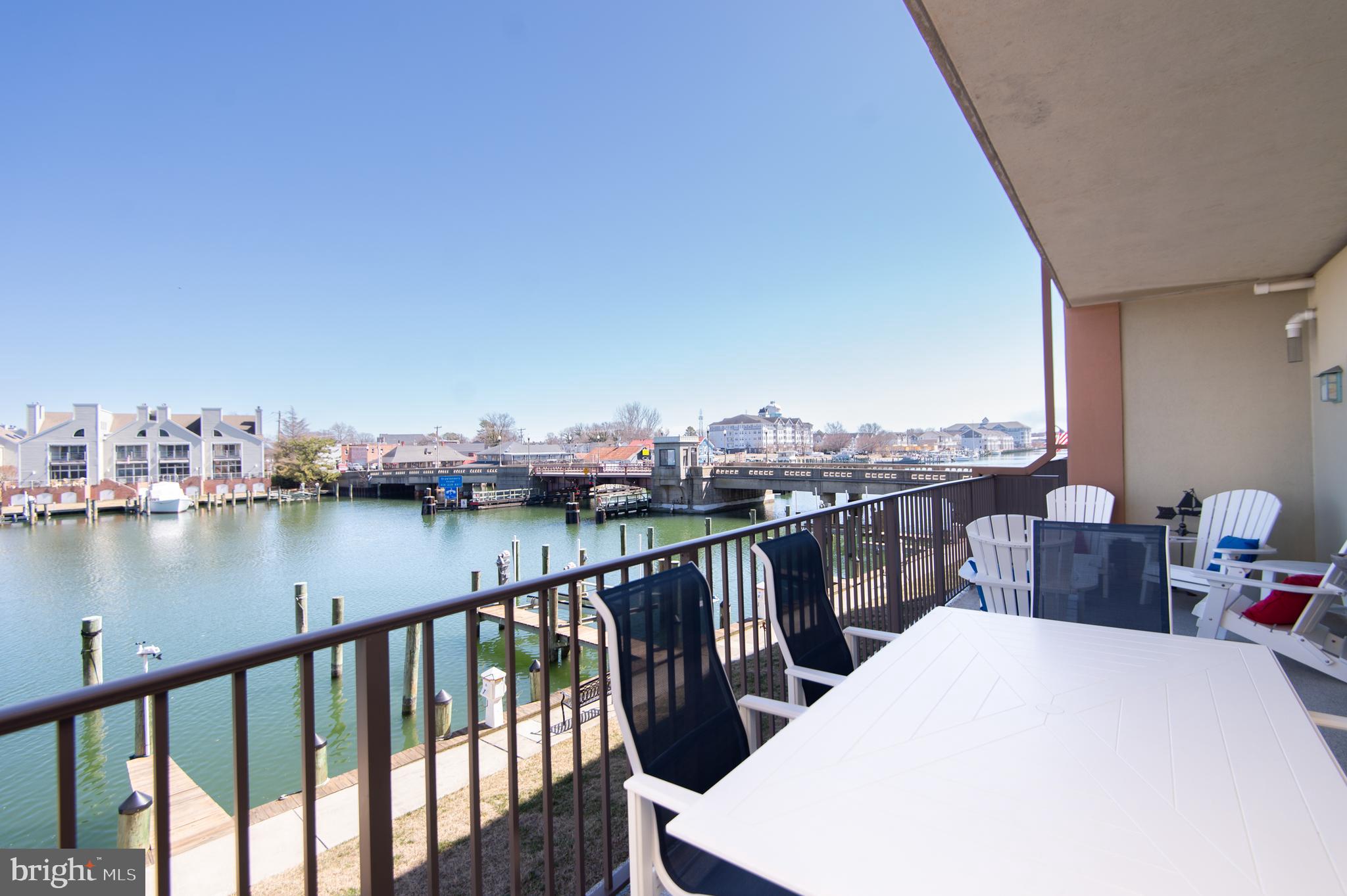 304 Academy Street, Unit 101 Cambridge, MD 21613 - Photo 4 of 56 a view of a balcony next to a lake view
