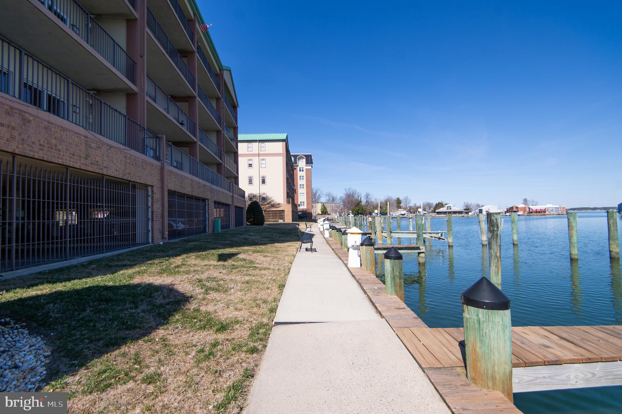304 Academy Street, Unit 101 Cambridge, MD 21613 - Photo 41 of 56 a view of a pathway with a building in the background