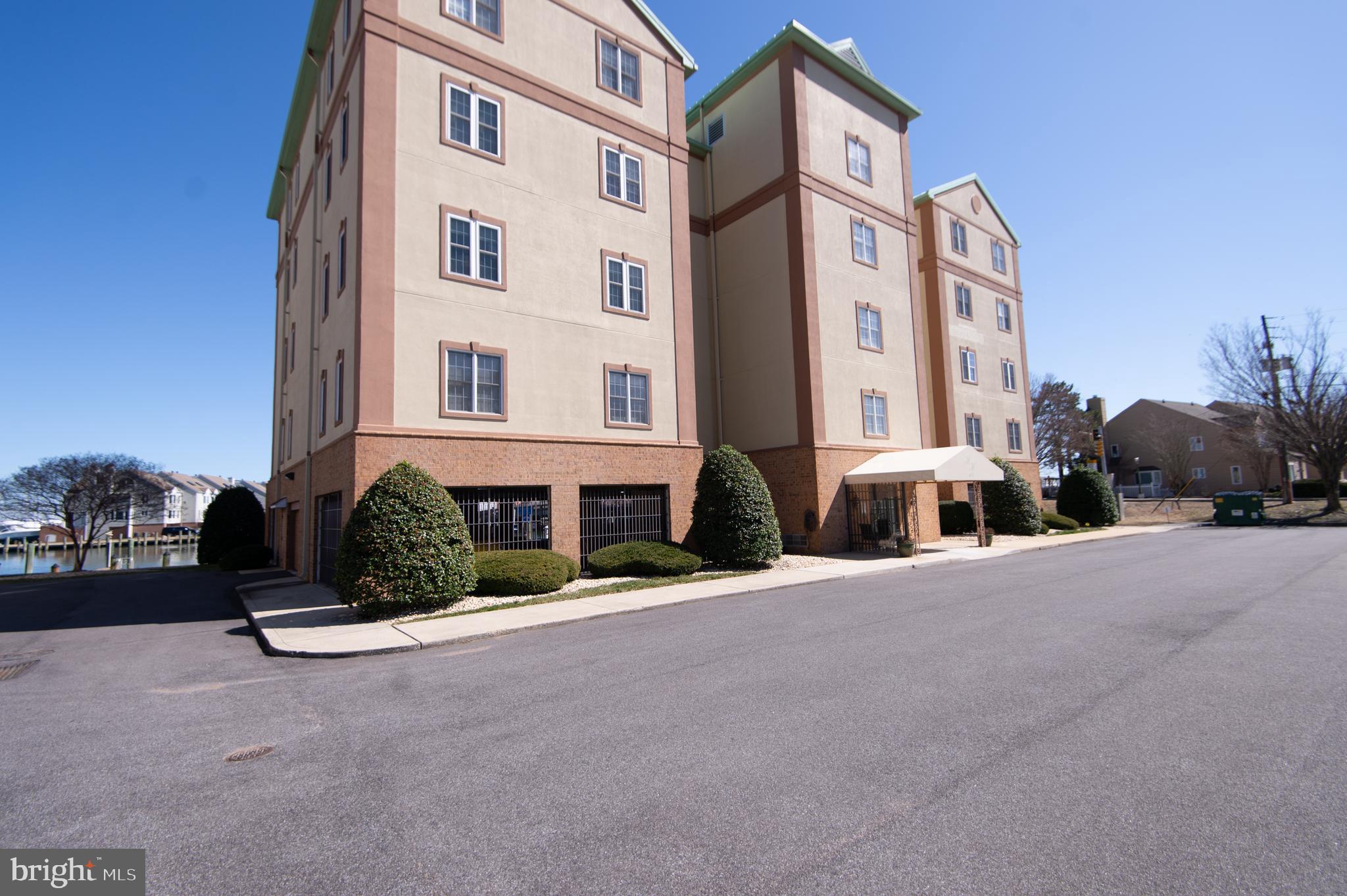 304 Academy Street, Unit 101 Cambridge, MD 21613 - Photo 43 of 56 a view of a building with a street