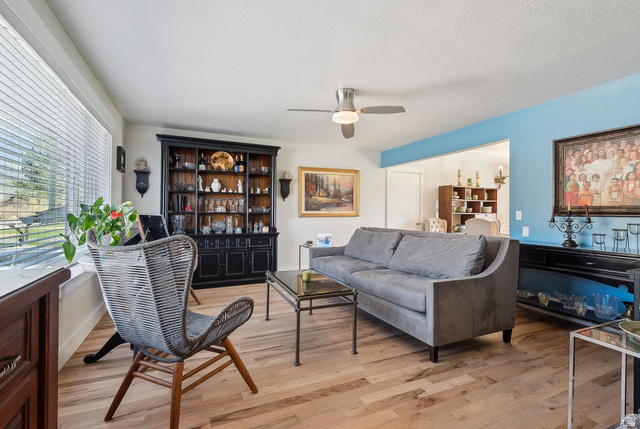 550 Pine Canyon Road Midway, UT 84049 - Photo 5 of 44 Warm-toned wood-finish flooring complements the room's bright aesthetic