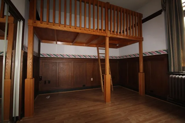 a view of a room with wooden walls