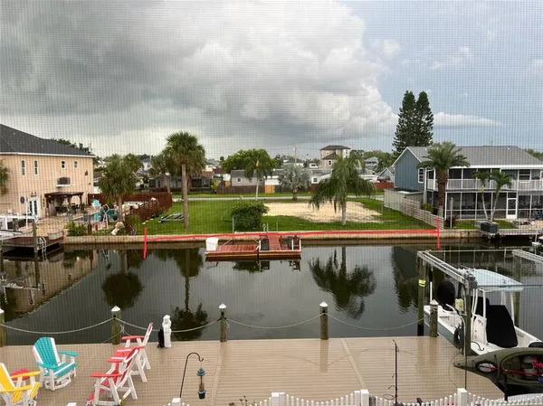a terrace with outdoor seating and city view
