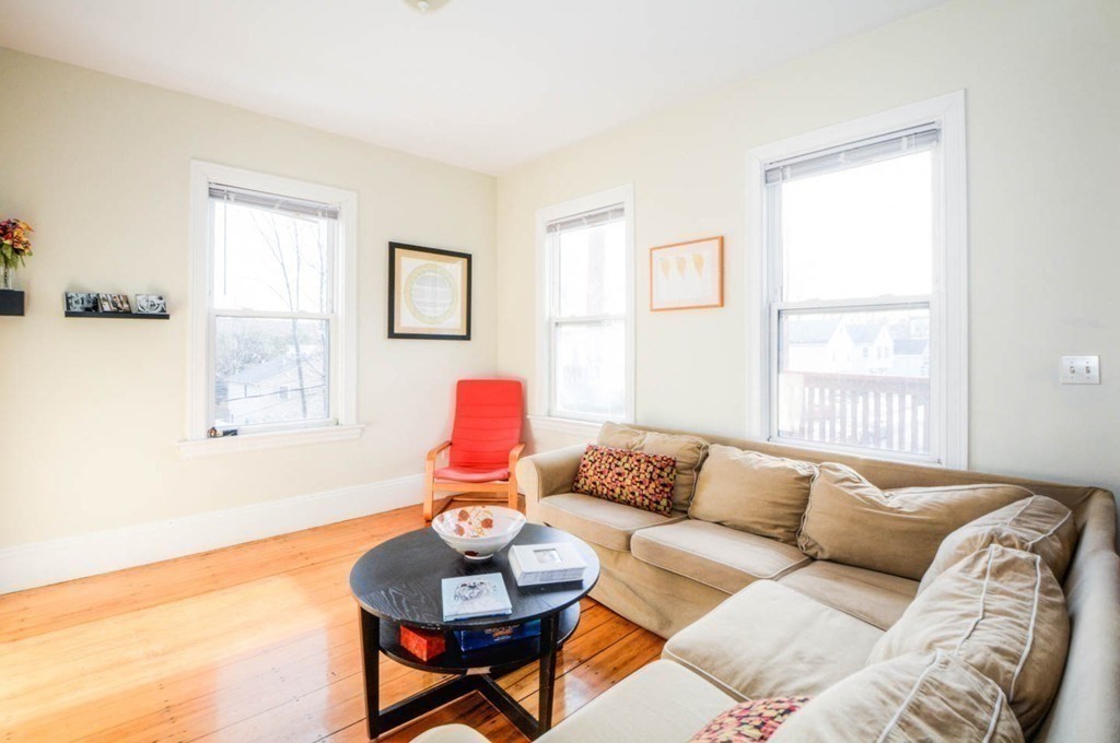 137 Paul Gore Street, Unit 2 Boston, MA 02130 - Photo 4 of 11 a living room with furniture and a window