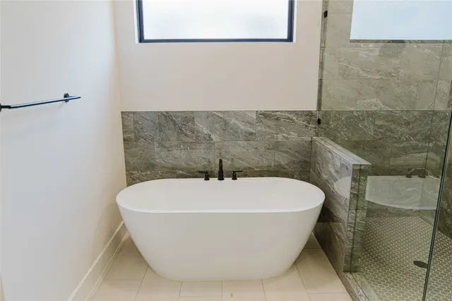 a white bath tub sitting in a bathroom