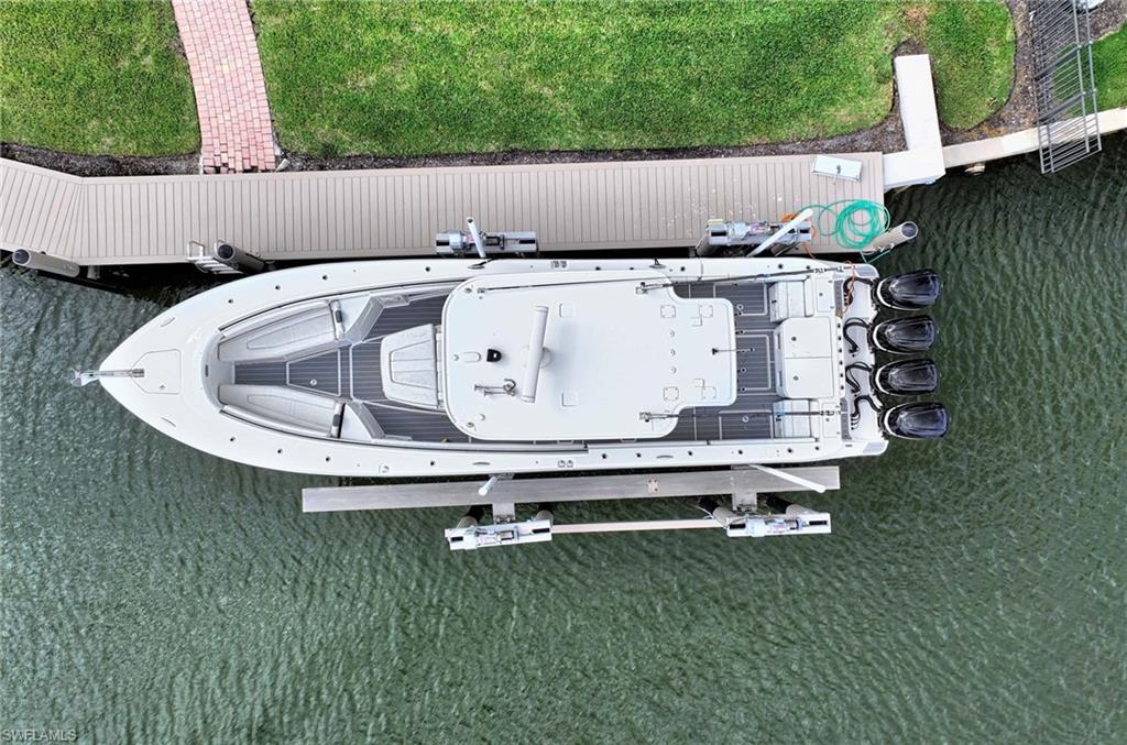 2390 Kingfish Road Naples, FL 34102 - Photo 32 of 37 a view of barbeque and outdoor space