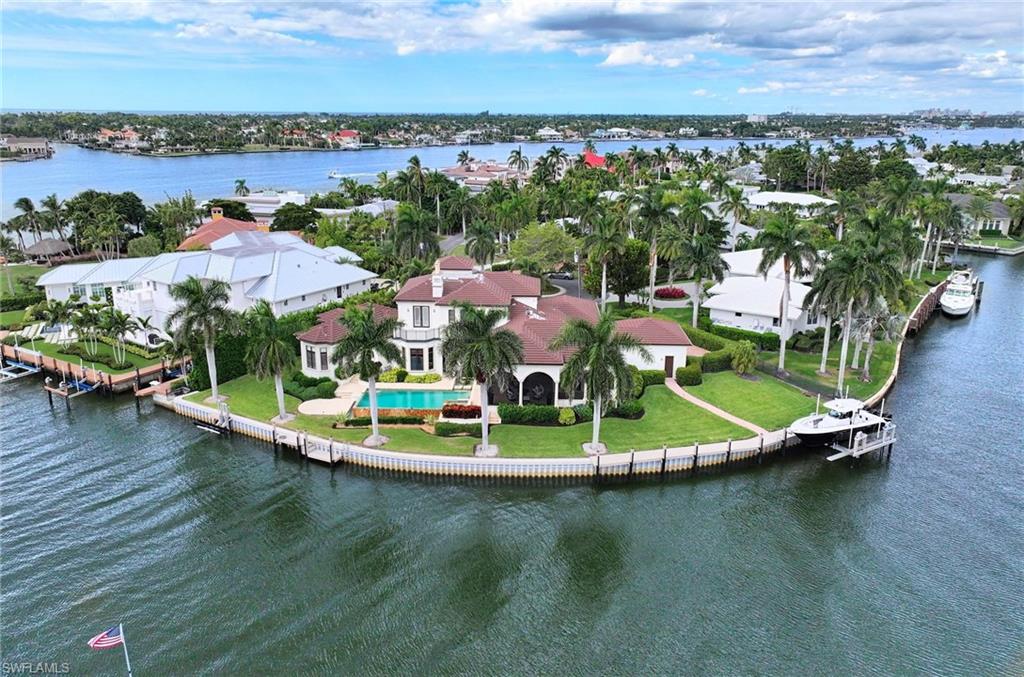 2390 Kingfish Road Naples, FL 34102 - Photo 33 of 37 a view of a lake with a mountain