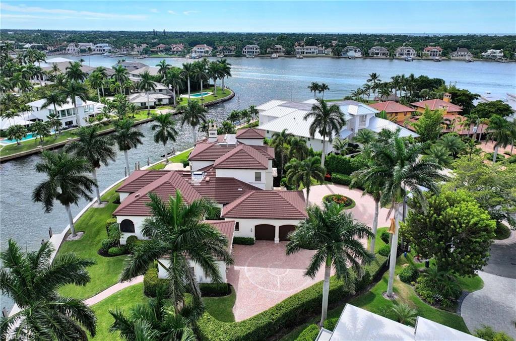 2390 Kingfish Road Naples, FL 34102 - Photo 34 of 37 an aerial view of lake and residential houses with outdoor space and river
