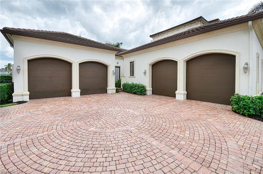 2390 Kingfish Road Naples, FL 34102 - Photo 37 of 37 a front view of a house with a yard