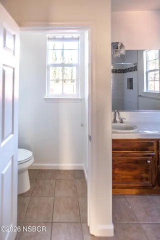 a view of hallway with wooden floor