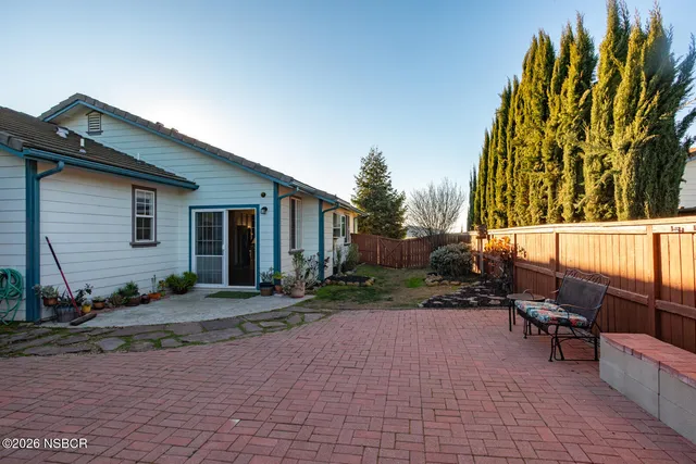 a view of a backyard of the house
