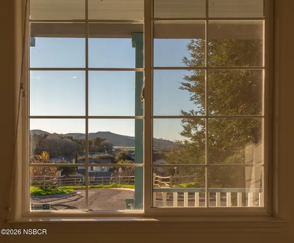 a kitchen with stainless steel appliances a stove a sink a microwave a refrigerator and cabinets