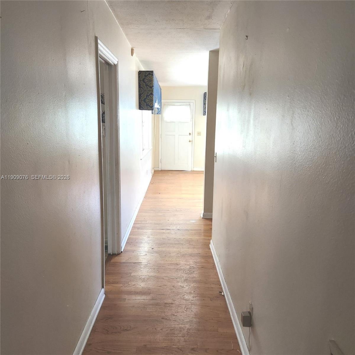 1547 West 10th Street Riviera Beach, FL 33404 - Photo 11 of 20 a view of hallway with wooden floor