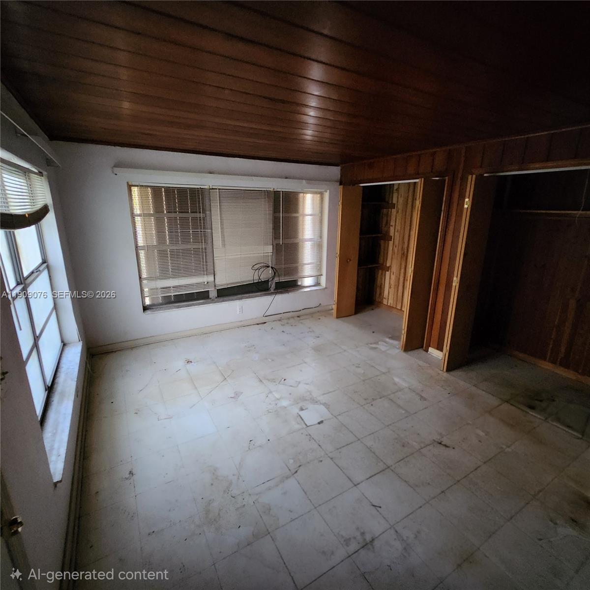 1547 West 10th Street Riviera Beach, FL 33404 - Photo 12 of 20 an empty room with windows