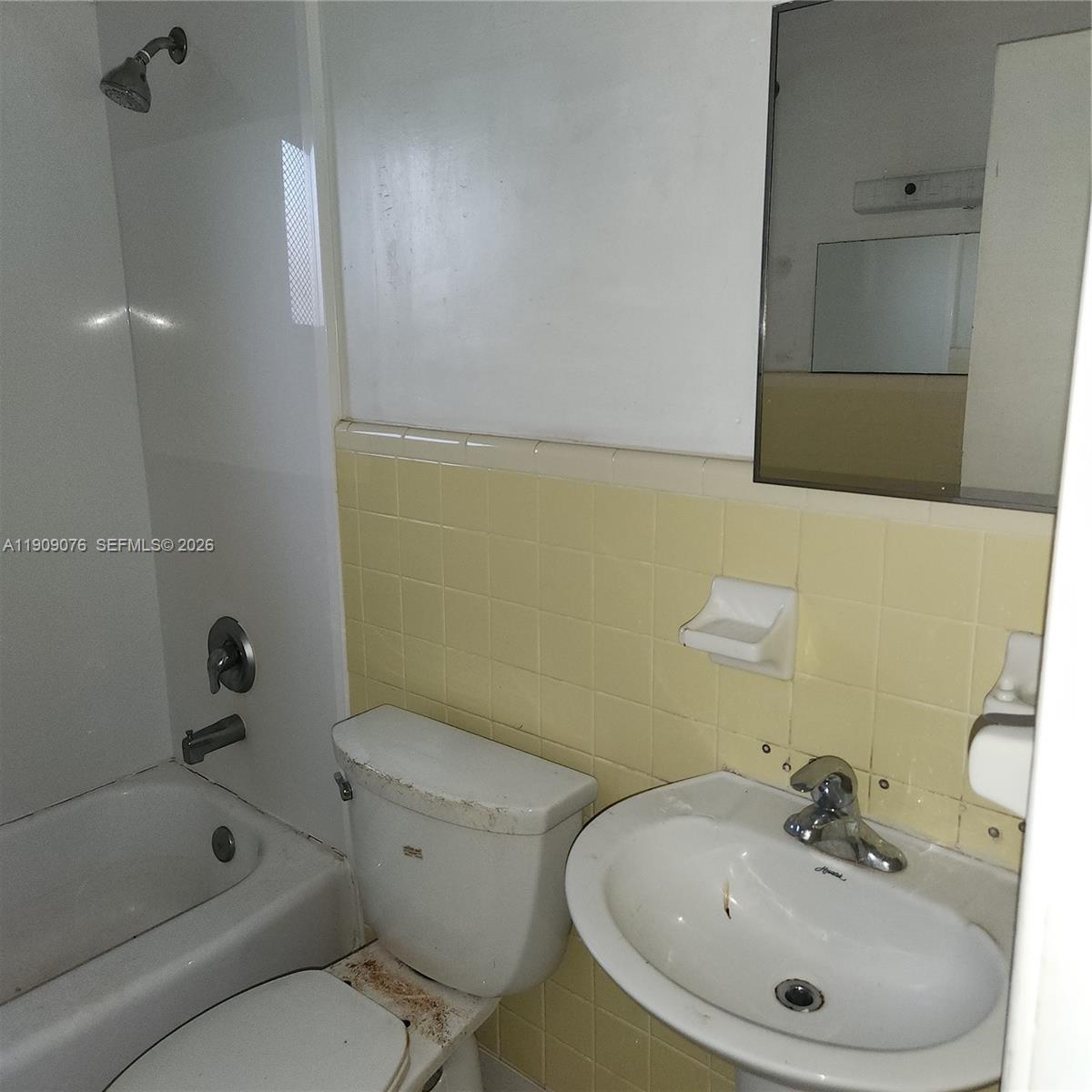 1547 West 10th Street Riviera Beach, FL 33404 - Photo 18 of 20 a bathroom with a sink a toilet and shower