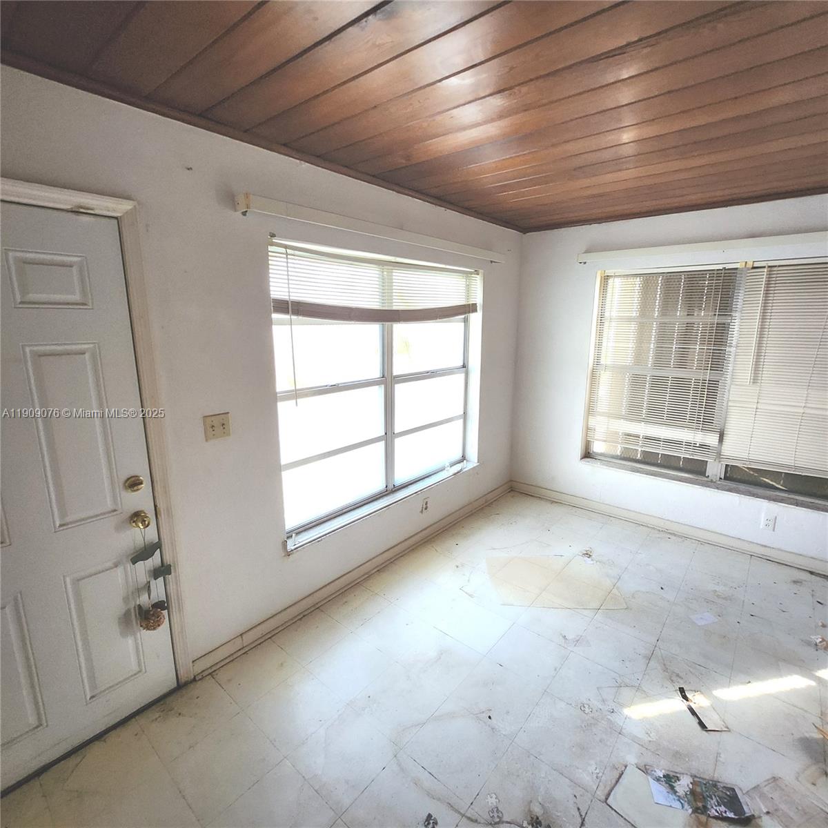 1547 West 10th Street Riviera Beach, FL 33404 - Photo 8 of 10 an empty room with windows
