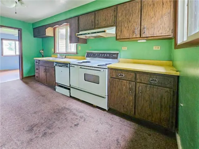 a utility room with washer and dryer