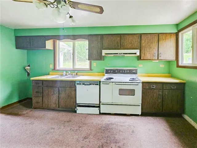a utility room with washer and dryer