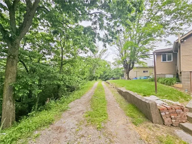 a view of a backyard with a garden