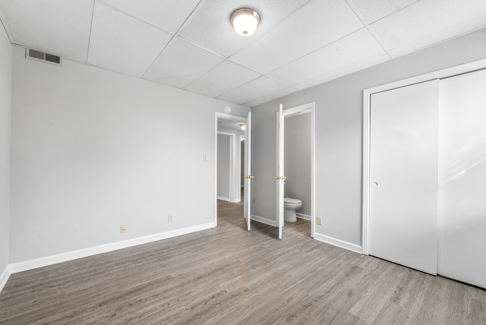 1600 Paradise Hill Road, Unit B Clarksville, TN 37043 - Photo 13 of 20 a view of an empty room with wooden floor