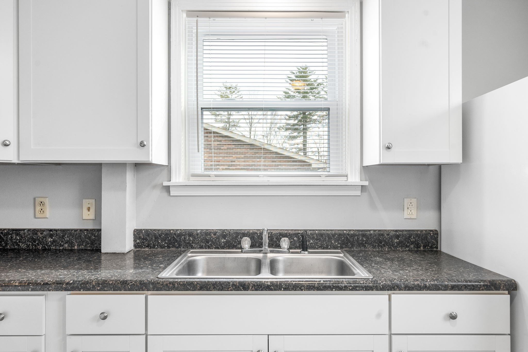 1600 Paradise Hill Road, Unit B Clarksville, TN 37043 - Photo 5 of 20 a kitchen with granite countertop white cabinets and a sink