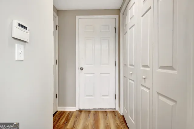 a view of an empty room with a window