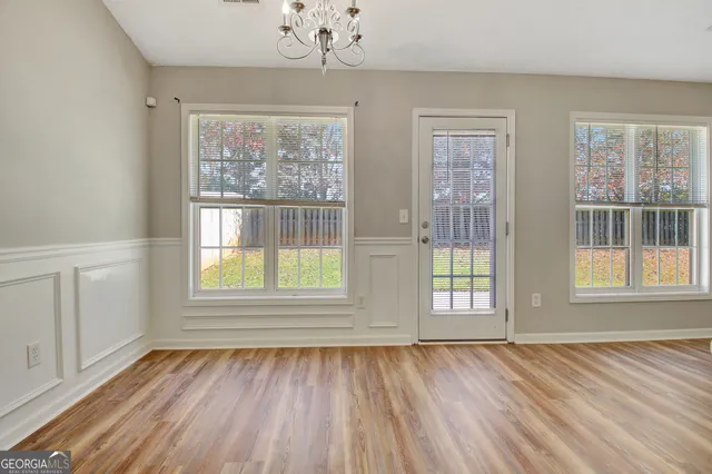 a white toilet sitting next to a bath tub