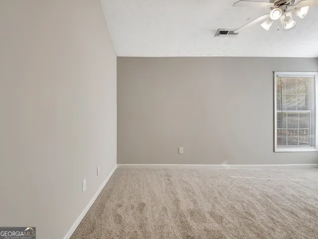 a white bath tub sitting next to a window