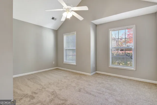 a white house covered with snow in front of it