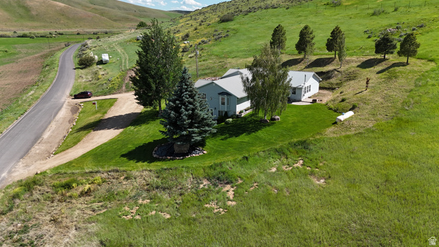 9029 North Treasureton Road Preston, ID 83263 - Photo 2 of 31 Expansive property with a single-story residence and sloped terrain