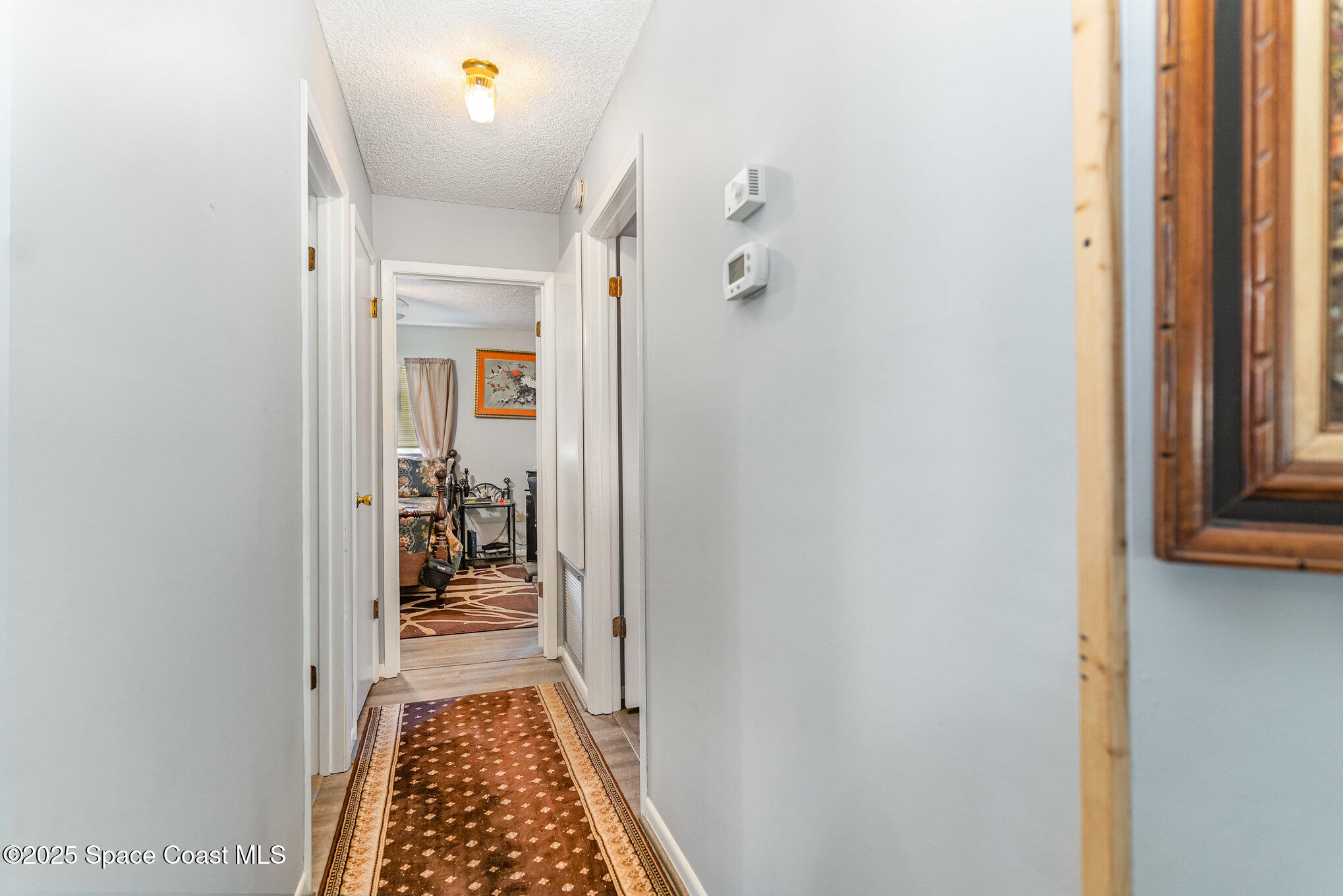 9980 Southwest 101st Lane Ocala, FL 34481 - Photo 13 of 25 a hallway with a dining table and chairs