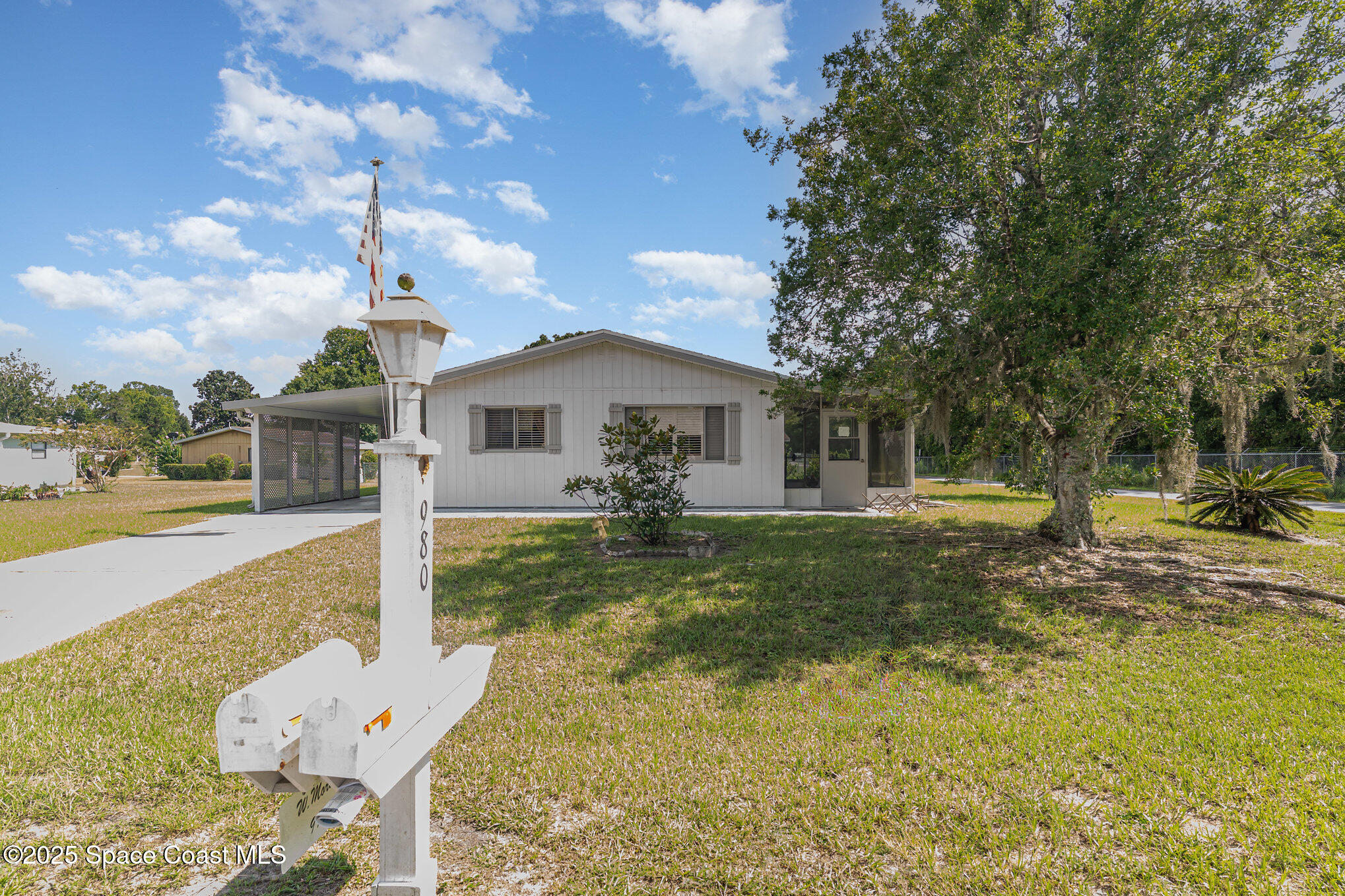 9980 Southwest 101st Lane Ocala, FL 34481 - Photo 2 of 25 a view of a house with backyard and sitting area