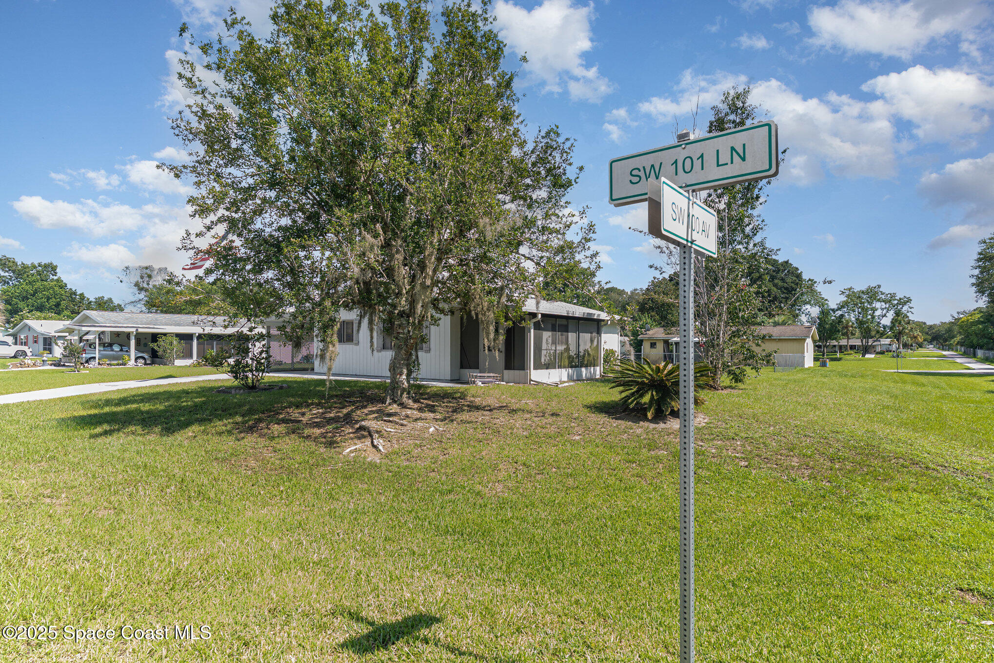 9980 Southwest 101st Lane Ocala, FL 34481 - Photo 3 of 25 a view of a house with a yard
