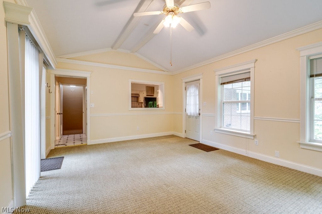 3060 Chamberlain Road Akron, OH 44333 - Photo 22 of 47 Carpeted empty room with ceiling fan, crown molding, and lofted ceiling