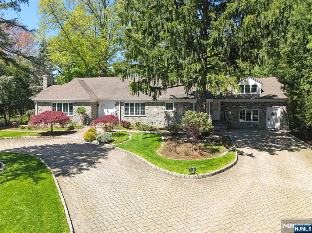 457 Summit Street Norwood, NJ 07648 - Photo 1 of 35 a view of a house with swimming pool and a yard