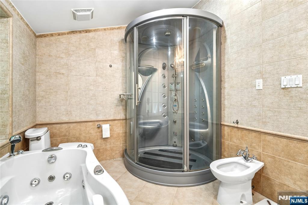 457 Summit Street Norwood, NJ 07648 - Photo 12 of 35 a bathroom with a sink and a mirror