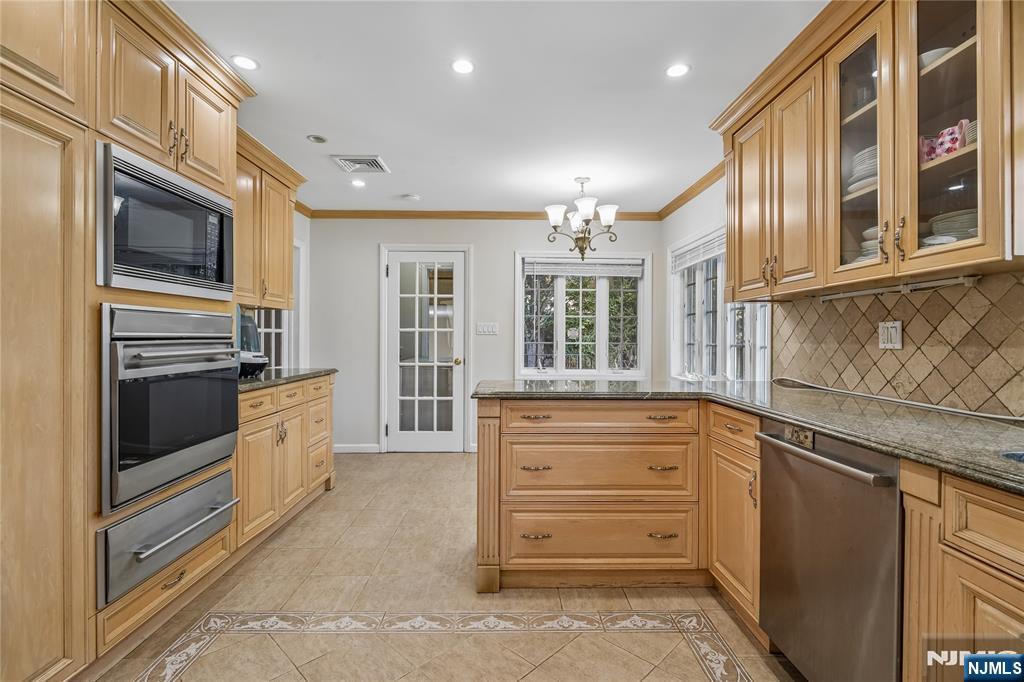 457 Summit Street Norwood, NJ 07648 - Photo 17 of 35 a kitchen with granite countertop stainless steel appliances and cabinets