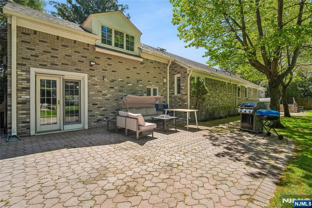 457 Summit Street Norwood, NJ 07648 - Photo 30 of 35 a backyard of a house with table and chairs