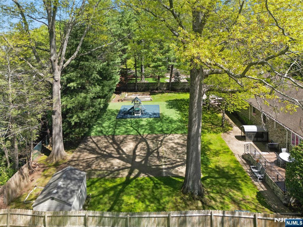 457 Summit Street Norwood, NJ 07648 - Photo 34 of 35 a view of a yard with plants and large trees