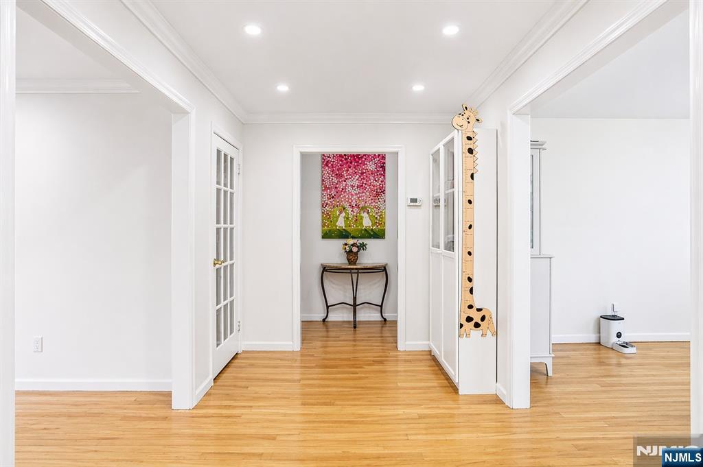 457 Summit Street Norwood, NJ 07648 - Photo 4 of 35 a view of a hallway with wooden floor and a living room