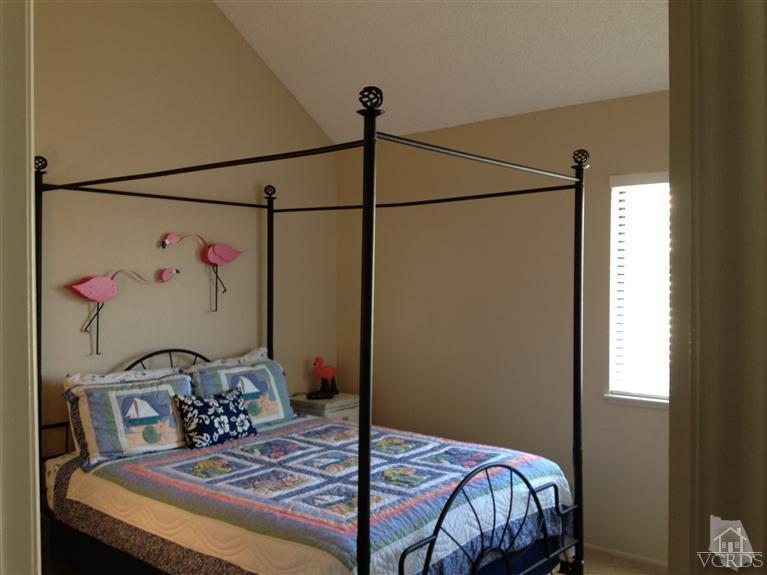 654 Terrace View Place Port Hueneme, CA 93041 - Photo 18 of 30 a bedroom with a bed a dresser and a window