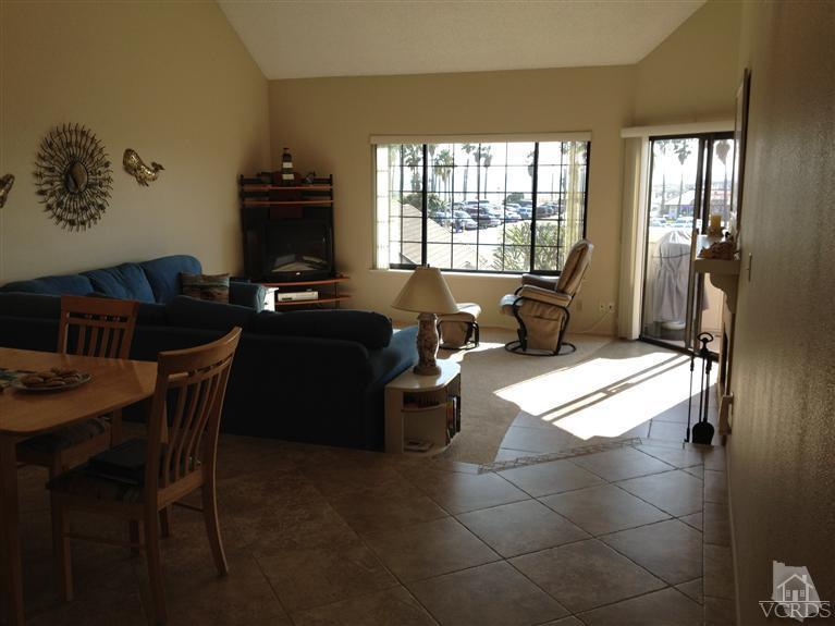 654 Terrace View Place Port Hueneme, CA 93041 - Photo 7 of 30 a living room with furniture a flat screen tv and a fireplace