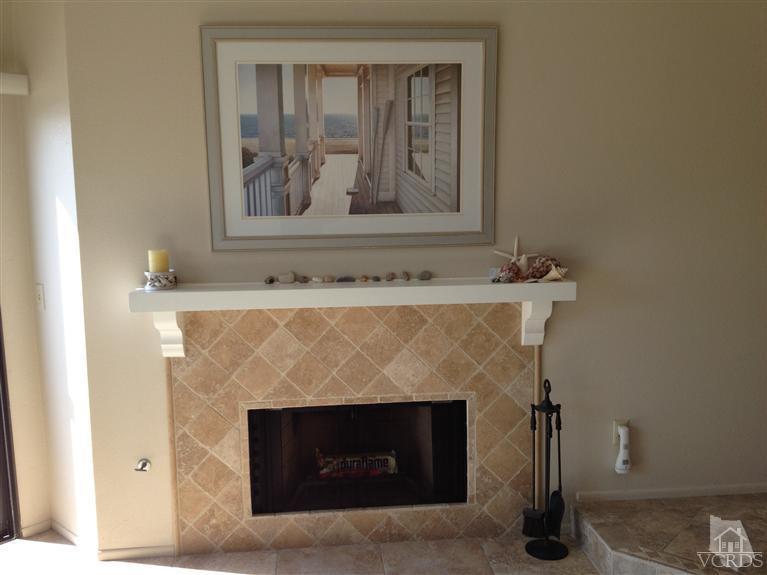 654 Terrace View Place Port Hueneme, CA 93041 - Photo 8 of 30 a fireplace with painting on the wall