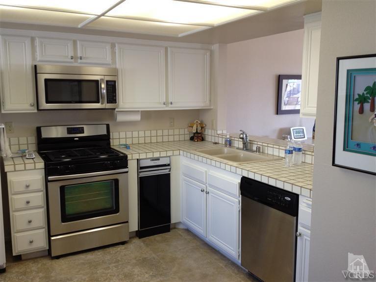 654 Terrace View Place Port Hueneme, CA 93041 - Photo 10 of 30 a kitchen with cabinets stainless steel appliances and a counter space